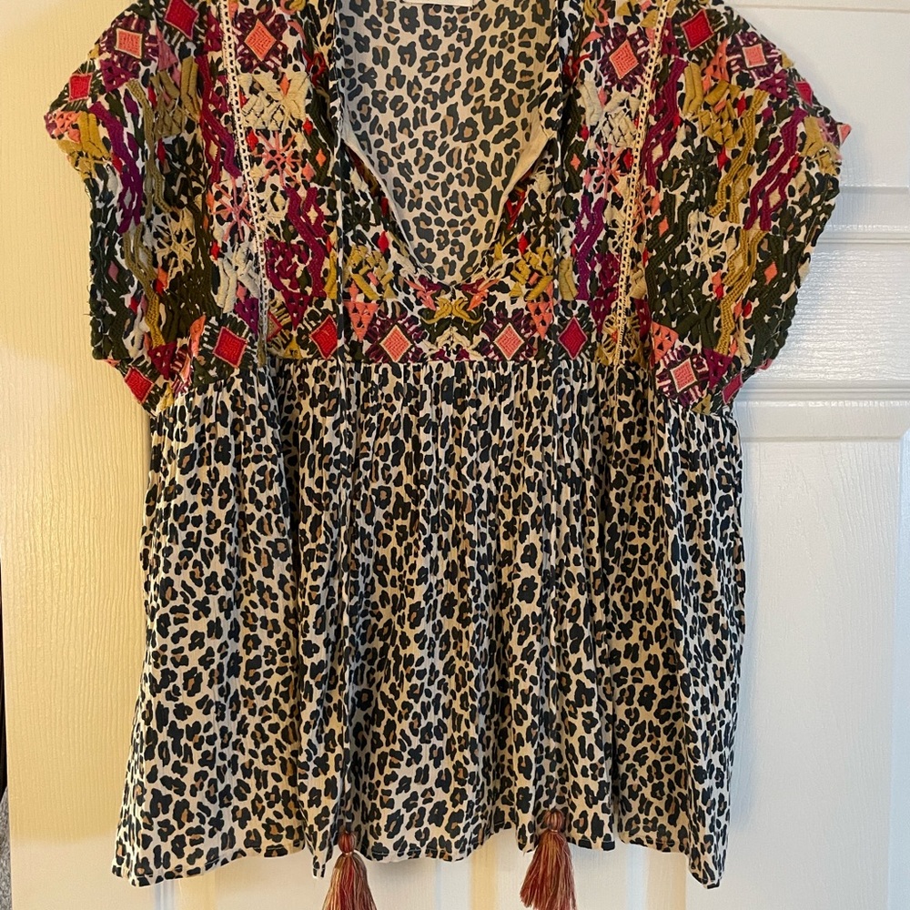 Fun and flowy shirt with tassels. Purchased in a small local boutique. Size SM